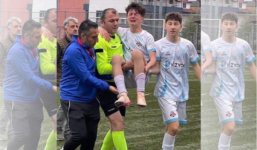 Sakatlanan futbolcuyu maçın hakemi kucağında taşıdı
